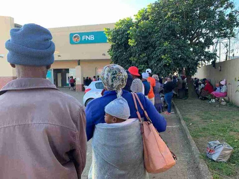Hundreds wait in line for social grants — here’s what to expect if you’re next.