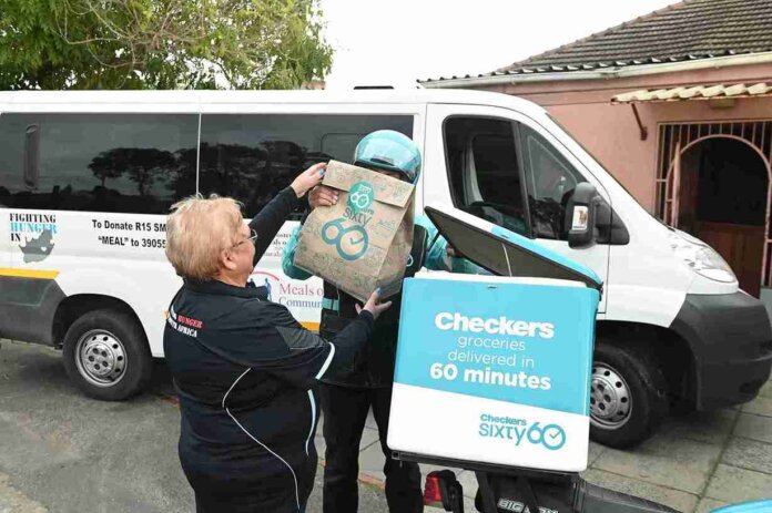Checkers Sixty60 Platform (web Or App) Volunteers packing food parcels for Mandela Day donation drive by Meals on Wheels and Checkers Sixty60