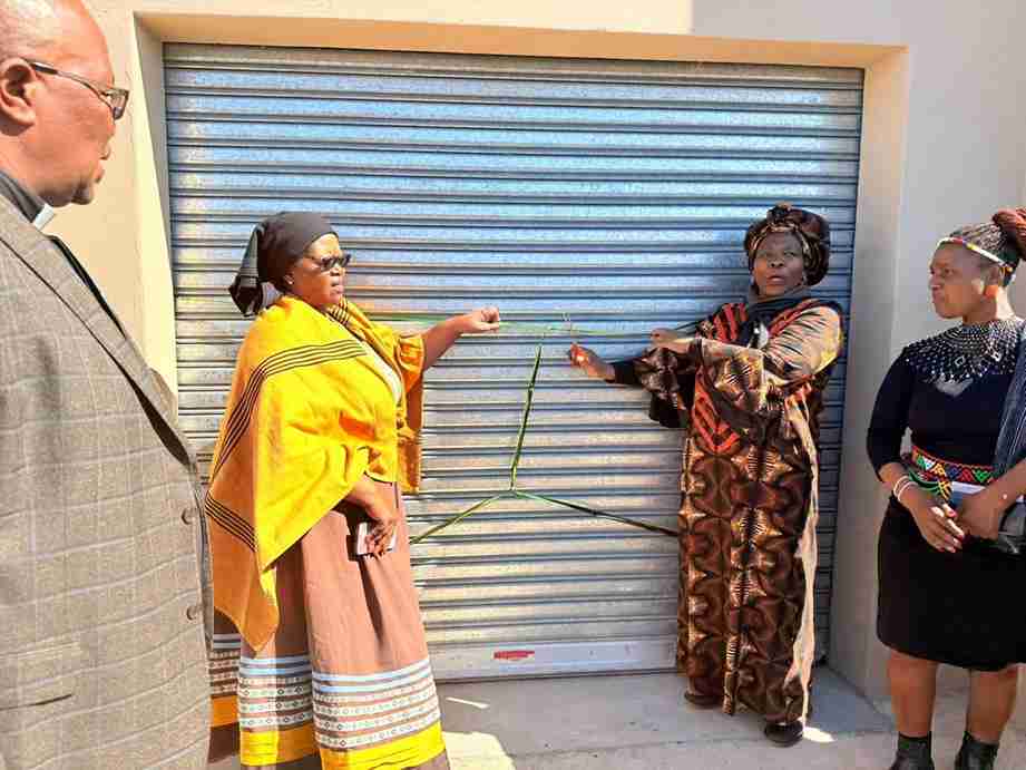 MEC Nonceba Kontsiwe watching while a sheep is being shed during the hand over of newly built and fully-equipped shearing in Chamama Forest village, Cofimvaba 